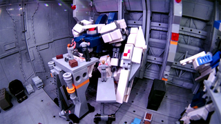 Illustration for article titled Model Hangars Look Much Better With Tiny Mecha Inside